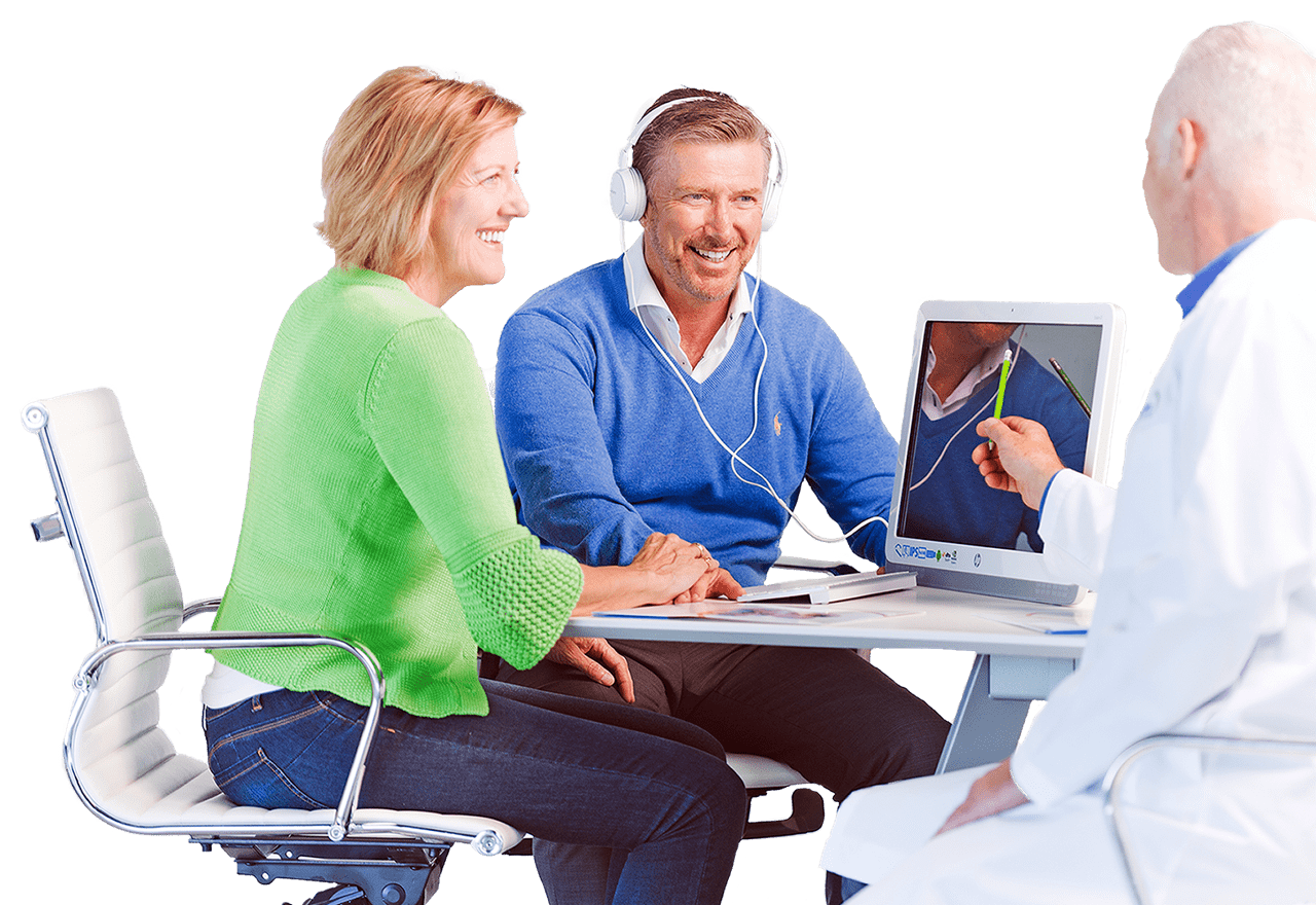 Middle Aged man sitting with his wife while having his hearing tested